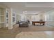 Spacious basement with built-in shelving, a gray couch, and a pool table at 13955 Craig Way, Broomfield, CO 80020