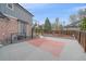 Backyard features a basketball court adjacent to a manicured lawn and wooden fencing at 13955 Craig Way, Broomfield, CO 80020