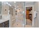 Stunning bathroom featuring a frameless glass shower with built-in bench and mosaic tile accents at 13955 Craig Way, Broomfield, CO 80020