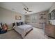 Cozy bedroom with a ceiling fan, neutral walls, and shelves displaying model cars at 13955 Craig Way, Broomfield, CO 80020