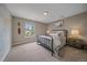 Inviting bedroom with neutral tones, a decorative map, and views to the outside at 13955 Craig Way, Broomfield, CO 80020