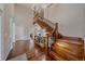 Grand foyer with high ceilings, hardwood floors, and a beautiful staircase with iron railings at 13955 Craig Way, Broomfield, CO 80020