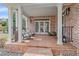 Inviting front porch with rocking chairs, offering a comfortable outdoor space to enjoy the view at 13955 Craig Way, Broomfield, CO 80020