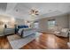 Main bedroom boasts a tray ceiling, hardwood floors, and ample natural light at 13955 Craig Way, Broomfield, CO 80020