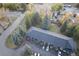 Aerial view of townhome complex with parking and mature trees at 5077 Camel Heights Rd # C, Evergreen, CO 80433
