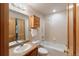 Bright bathroom with a shower, toilet, vanity, and medicine cabinet at 5077 Camel Heights Rd # C, Evergreen, CO 80433
