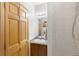 Well-lit bathroom boasts a vanity, storage cabinet, and combined shower-tub at 5077 Camel Heights Rd # C, Evergreen, CO 80433
