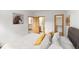 Bedroom featuring a comfortable bed and access to the bathroom and closet at 5077 Camel Heights Rd # C, Evergreen, CO 80433
