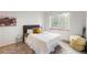 Bedroom with large window and comfortable bed with stylish accent pieces at 5077 Camel Heights Rd # C, Evergreen, CO 80433