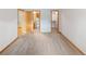 Bedroom with carpet flooring and doorways to bathroom and closet at 5077 Camel Heights Rd # C, Evergreen, CO 80433