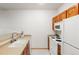 Efficient kitchen featuring bright white appliances and light countertops at 5077 Camel Heights Rd # C, Evergreen, CO 80433