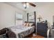 Comfortable bedroom featuring a bed, dresser, and ceiling fan at 6736 Grove St, Denver, CO 80221