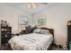 Relaxing bedroom with a comfortable bed and natural light from bright windows at 6736 Grove St, Denver, CO 80221