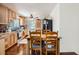 Cozy kitchen featuring wood cabinets, modern appliances, and tile backsplash at 6736 Grove St, Denver, CO 80221
