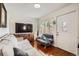 Inviting living room featuring hardwood floors, modern furniture, and natural light at 6736 Grove St, Denver, CO 80221