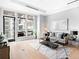 Bright living room boasts floor-to-ceiling windows and access to a private balcony with outdoor seating at 7600 Landmark Way # 914, Englewood, CO 80111