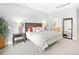 Bright main bedroom with neutral tones, plush carpeting, and access to an en-suite bathroom at 7600 Landmark Way # 914, Englewood, CO 80111