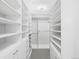 Spacious walk-in closet with custom shelving and ample storage space for clothing and accessories at 7600 Landmark Way # 914, Englewood, CO 80111