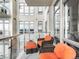 Private balcony with wicker chairs and city views at 7600 Landmark Way # 914, Englewood, CO 80111