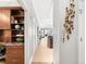 Elegant hallway with built-in shelving and views into the living area and kitchen at 7600 Landmark Way # 914, Englewood, CO 80111