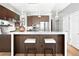 Modern kitchen with island, stainless steel appliances, and breakfast bar at 7600 Landmark Way # 914, Englewood, CO 80111