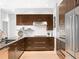 Modern kitchen with stainless steel appliances and an island at 7600 Landmark Way # 914, Englewood, CO 80111