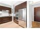 Modern kitchen with stainless steel appliances and dark wood cabinets at 7600 Landmark Way # 914, Englewood, CO 80111