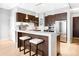 Open concept kitchen with island and breakfast bar at 7600 Landmark Way # 914, Englewood, CO 80111