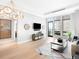 Spacious living room boasts hardwood floors, large windows and city views at 7600 Landmark Way # 914, Englewood, CO 80111