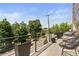 Outdoor balcony with chairs and lush greenery views at 2851 W 23Rd Ave # 1, Denver, CO 80211
