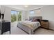 Light-filled bedroom with a large window and plush bedding at 2851 W 23Rd Ave # 1, Denver, CO 80211