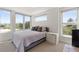 Bright bedroom with large windows, a comfortable bed, and stylish nightstands, offering scenic city views at 2851 W 23Rd Ave # 1, Denver, CO 80211