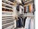 Walk-in closet with organized shelving and hanging racks, providing ample storage space for clothes and accessories at 2851 W 23Rd Ave # 1, Denver, CO 80211