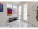 Bright entryway with marble floors, artwork, and a modern bench at 2851 W 23Rd Ave # 1, Denver, CO 80211
