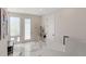 Bright entryway with marble floors, artwork and coat rack at 2851 W 23Rd Ave # 1, Denver, CO 80211