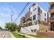 Modern townhome exterior featuring balconies, clean lines, and stylish landscaping at 2851 W 23Rd Ave # 1, Denver, CO 80211