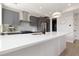 Stylish kitchen with stainless steel appliances, gray cabinets, and white countertops at 2851 W 23Rd Ave # 1, Denver, CO 80211