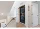 Convenient upper-level laundry area with a stacked washer and dryer, maximizing space and efficiency at 2851 W 23Rd Ave # 1, Denver, CO 80211