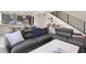 Comfortable living room with a sectional sofa, throw pillows, and an open layout at 2851 W 23Rd Ave # 1, Denver, CO 80211