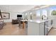Open floor plan showcasing the kitchen, dining, and living areas with ample natural light at 2851 W 23Rd Ave # 1, Denver, CO 80211