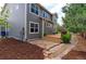 Charming home featuring an outdoor deck with stone patio and mulch, creating a tranquil and inviting backyard space at 2901 Madison Ln, Broomfield, CO 80023
