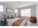 Bedroom with a soft rug, chair, neutral walls, and a large window at 2901 Madison Ln, Broomfield, CO 80023