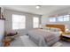 Bedroom with a stylish rug, neutral walls, and three large windows at 2901 Madison Ln, Broomfield, CO 80023