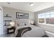 Bedroom with a soft rug, neutral walls, and a large window at 2901 Madison Ln, Broomfield, CO 80023