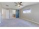 Spacious bedroom with carpet, sliding barn door to bathroom and natural light at 2901 Madison Ln, Broomfield, CO 80023