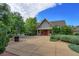 Beautiful clubhouse with stone accents, surrounded by lush landscaping, a sculpture, and a welcoming entrance at 2901 Madison Ln, Broomfield, CO 80023