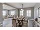 Elegant dining room with a large table, seating for six, and a view into the living room at 2901 Madison Ln, Broomfield, CO 80023