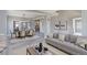 Open concept living and dining area with gray walls, light floors, and decorative accents at 2901 Madison Ln, Broomfield, CO 80023