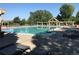 Resort style pool with pergola covered lounge areas and ample deck chairs at 2901 Madison Ln, Broomfield, CO 80023