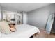 Cozy bedroom with mirrored closet doors and neutral color palette at 1300 Garfield St # 9, Denver, CO 80206